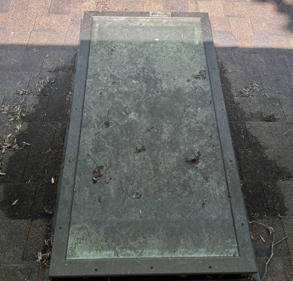 Skylight covered in grime before cleaning