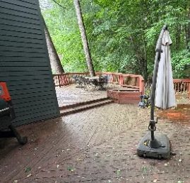 Weathered gray wood deck before cleaning