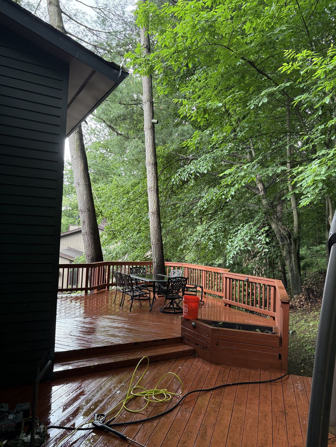 Wood deck after pressure washing, rich clean color restored