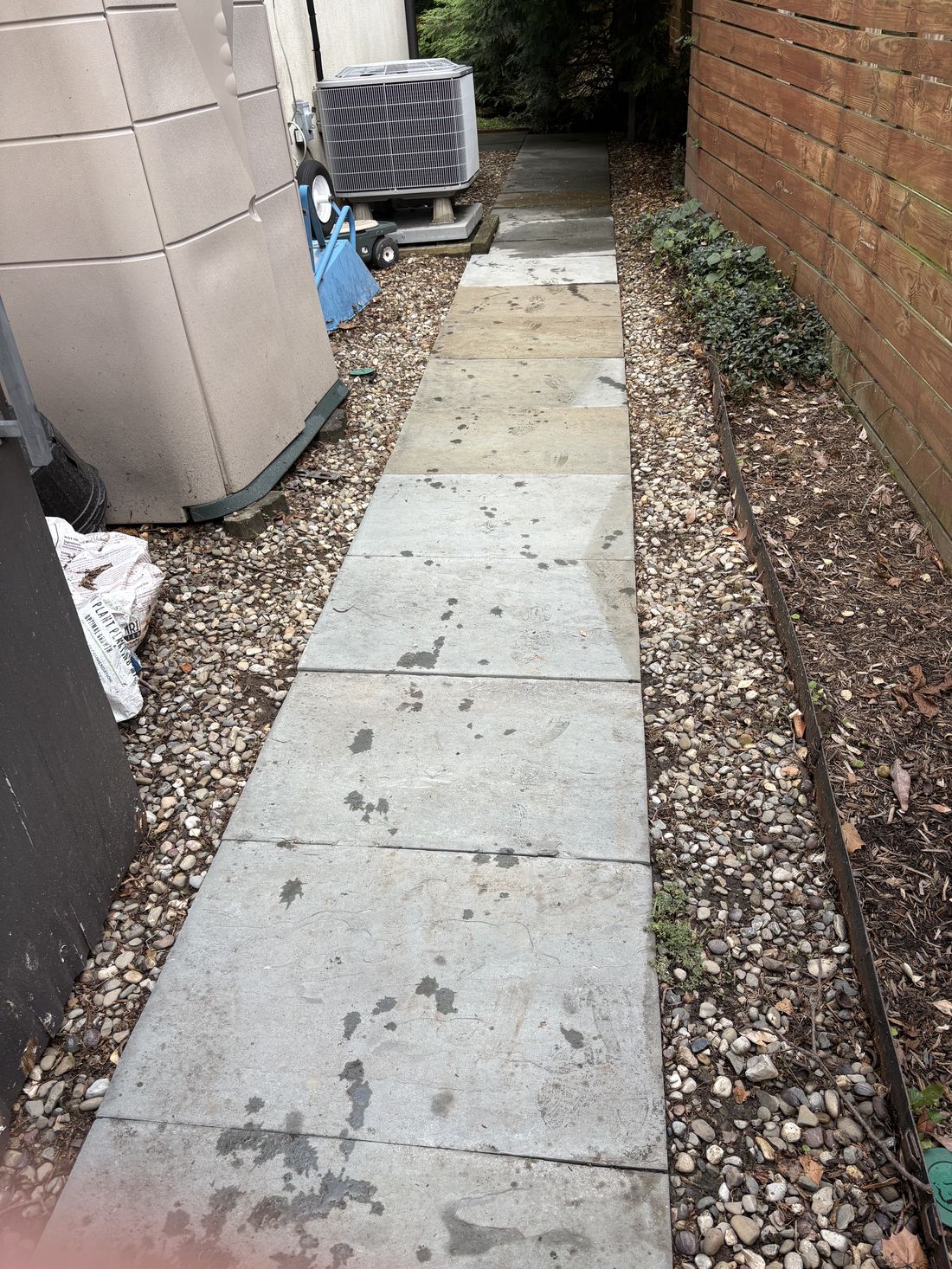 Concrete walkway after pressure washing, clean bright concrete